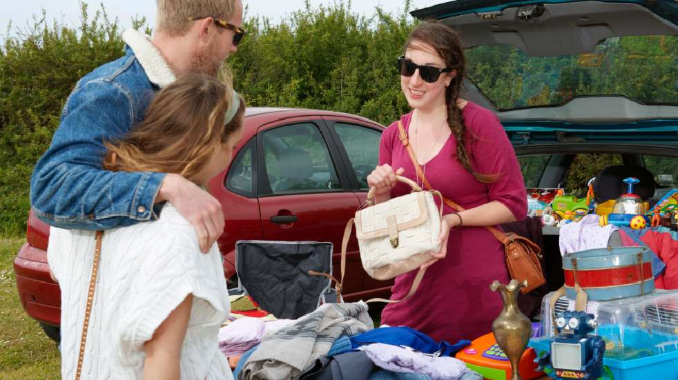 How to do a car boot sale couple looking at handbag